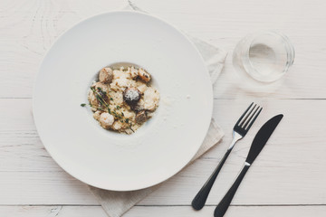 Wild mushrooms risotto with rosemary and parmesan, italian cuisine