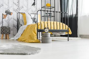 Teenager's bedroom with clock