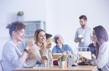 Workers eating at the office