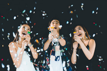 celebration Party, holding .colorful confetti and happy, having fun, Group of beautiful young people