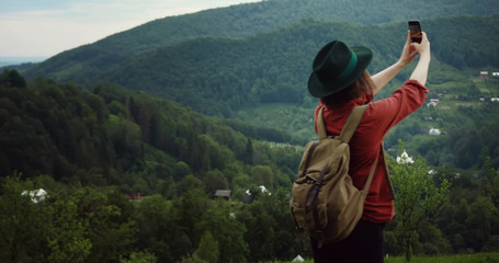 Fototapeta na wymiar tourist girl with phone and backpack