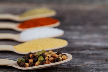 Various colorful spices on wooden table
