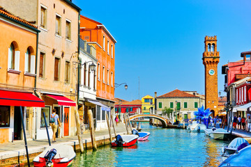 Fototapeta na wymiar View of the colorful Venetian houses along the canal at the Islands of Murano in Venice.