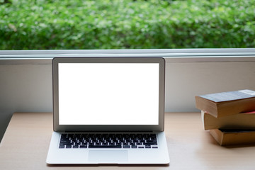 Computer laptop and old vintage book