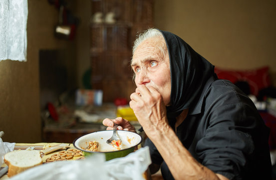 Elderly Woman Eating Soup