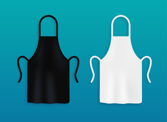 White and black kitchen aprons. Chef uniform for cooking. - obrazy, fototapety, plakaty