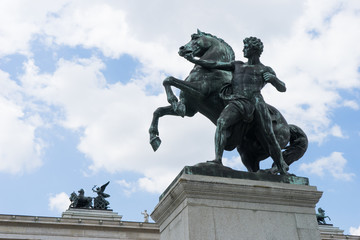 Fototapeta na wymiar Bronze statue of the horse tamer in front of the Austrian Parliament Building, Vienna, Austria