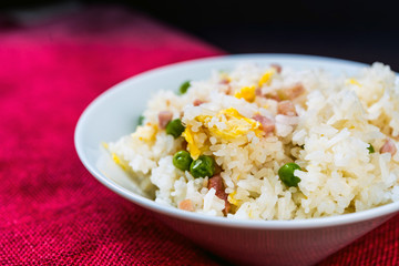 Homemade Chinese fried rice with vegetables and fried eggs