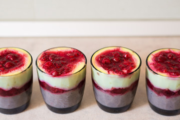 Chocolate pudding with red fruits on top