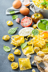 Italian food and ingredients, ravioli pasta tortellini pesto tomato sauce