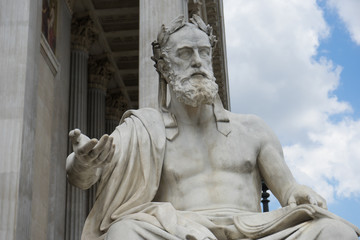 Portrait of the stone statue of greek philosopher Xenophon in front of the austrian parliament in Vienna