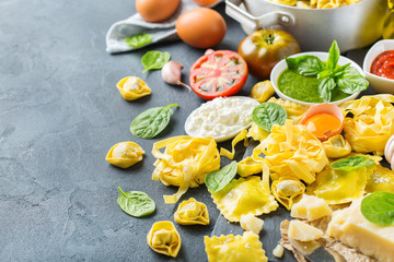 Italian food and ingredients, ravioli pasta tortellini pesto tomato sauce