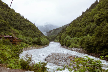 Fototapeta na wymiar Foggy mountain and river