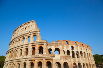 Fototapeta na wymiar Colosseum against the blue sky in Rome, Italy
