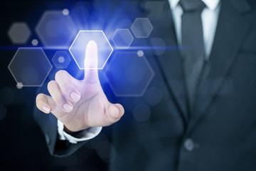 Businessman pointing his finger with hexagon icon