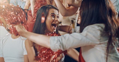 Fans cheering for sports team