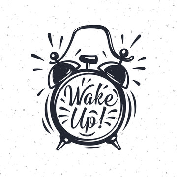 Wake up! inscription on gold Alarm Clock.