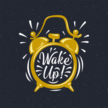 Wake up! inscription on gold Alarm Clock.