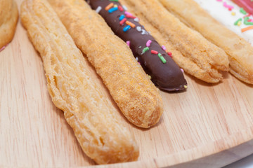 colorful doughnut Stick on wooden plate