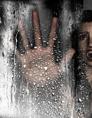 Steam room apocalypse,3d illustration of screaming woman put her hand against wet glass with condensation effect,Horror background,mixed media