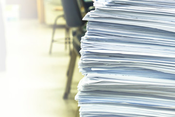 Paper documents stacked in archive