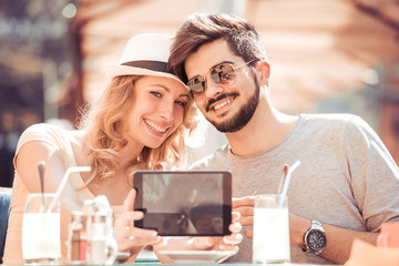 Young couple taking a selfie