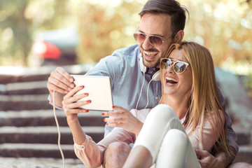 Couple taking photo in the city.