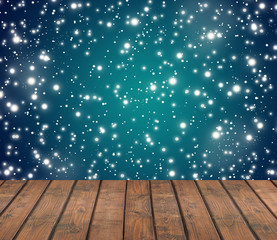 Naklejka na ściany i meble Empty wooden deck on winter background with snow flakes.