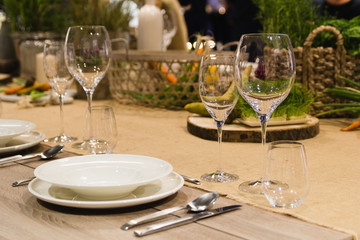 Table setting decor with cutlery, plates and glasses