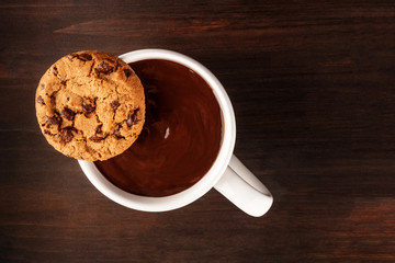 Chocolate chips cookie on dark background with copy space