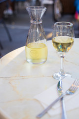 A glass of wine and white wine in a cafe on the table.