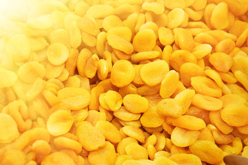 Dried apricots in the store. Background. Toned.