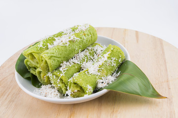 Malaysian traditional cake (Dadar gulung or Ketayap) made from flour, coconut steeped,palm sugar and pandanus flavors