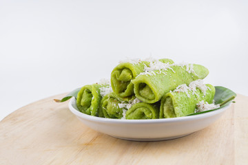 Malaysian traditional cake (Dadar gulung or Ketayap) made from flour, coconut steeped,palm sugar and pandanus flavors