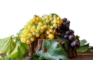 juicy white and red grape fruit on wood background .