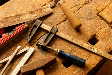  Carpentry tools on old oak workbench.