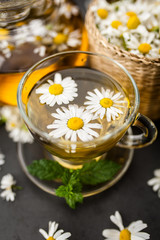 Fototapeta na wymiar Cup of chamomile tea