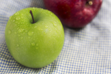 green apple on a cloth background.