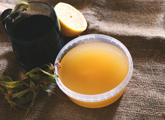 natural treatment of colds and flu. Hot tea with lime, lemon, honey. Traditional medicine