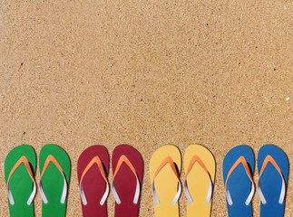 Man lifestyle four relax flip flops on orange sand background
