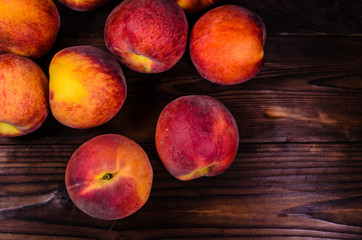 Fresh ripe peaches on wooden table. Top view