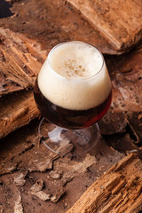 Dark beer on bark