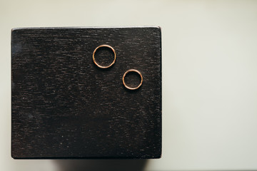 Wedding rings on black surface