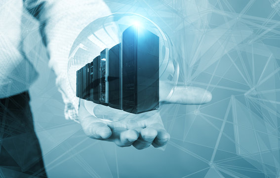 Businessman holding a hologram with supercomputers inside the concept of big data