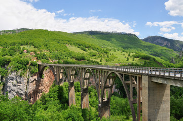 Fototapeta na wymiar Djurdjevic's Bridge - a concrete arch bridge across the Tara River in Montenegro