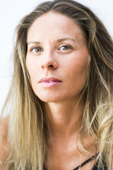 Fototapeta premium Portrait of the face of a beautiful blond woman on white background