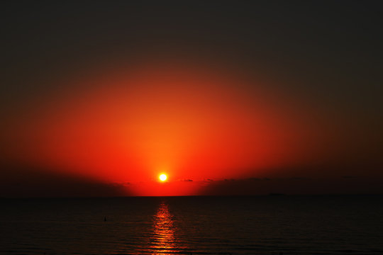 Scenic view of beautiful sunset above the sea .