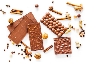 Chocolate bars on white background top view