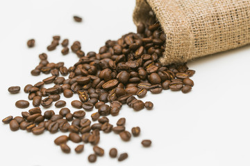 Roasted coffee beans on white background