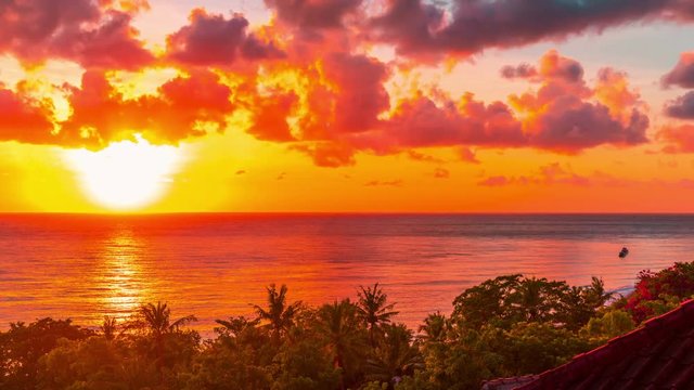 Sunrise time-lapse over the Lombok Strait to the volcano Rinjani on the island of Lombok as seen from the Amed area of eastern Bali, Indonesia.
